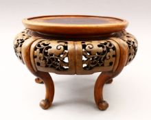 A GOOD 19TH CENTURY CHINESE CARVED AND PIERCED HARDWOOD STAND, stood upon five carved curving
