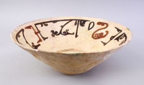 A GOOD EARLY ISLAMIC POTTERY BOWL, with painted decoration interior, (AF), 29cm diameter.
