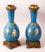 A PAIR OF 19TH CENTURY CHINESE PORCELAIN BOTTLE VASES / LAMP BASES, the ground with gilded