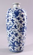 A GOOD CHINESE BLUE AND WHITE VASE, painted all over with dragons and phoenix amongst clouds,