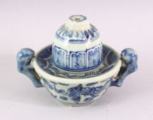 AN UNUSUAL BLUE AND WHITE POTTERY TWIN HANDLED BOWL AND COVER, 10cm high.