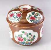 A 19TH CENTURY CHINESE CAFE AU LAIT GLAZED BOWL AND COVER, painted with panels of chrysanthemums,