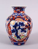 A JAPANESE MEIJI PERIOD IMARI PORCELAIN VASE, decorated with panel views of pine trees, phoenix
