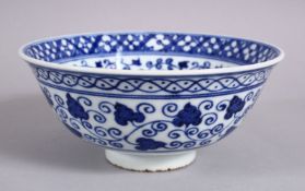 A CHINESE BLUE & WHITE MING STYLE PORCELAIN BOWL, with a central display of lotus, with