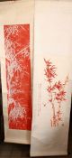 TWO CHINESE RED INK SCROLL PICTURES, both depicting bamboo, both with a calligraphic script,