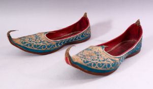 A PAIR OF TURKISH EMBROIDERED LEATHER SHOES.