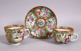 A 19TH CENTURY CHINESE FAMILLE ROSE CANTON CUPS & SAUCER, decorated with panels of birds and flora &