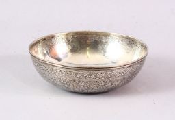 A SMALL PERSIAN SILVER CIRCULAR BOWL, with engraved decoration, 11cm diameter.