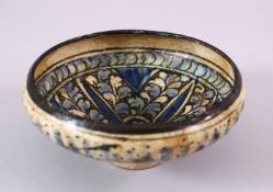 AN EARLY PERSIAN SULTAN ABBAD POTTERY BOWL, with floral decoration, 16cm.