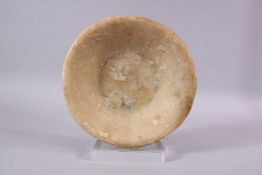 AN EYGPTIAN ALABASTER SHALLOW CIRCULAR BOWL, 23cm diameter.
