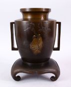 A JAPANESE MEIJI PERIOD BRONZE & MIXED METAL INLAID VASE & STAND with decoration of two figures in a