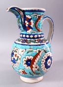 A 19TH CENTURY KUTAHYA JUG, decorated in the Iznik taste, 26cm high.