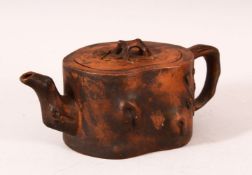 A CHINESE YIXING TEAPOT, of naturalistic form, 20cm wide.