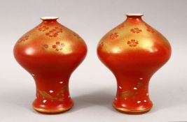 AN UNUSUAL PAIR OF JAPANESE MEIJI PERIOD CORAL RED FUKAGAWA PORCELAIN VASES, the unusual vases