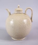 A GOOD CHINESE DING WARE POTTERY WINE EWER, the body with carved decoration 20cm x 17cm