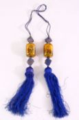 A SET OF 19TH / 20TH CENTURY CHINESE REVERSE PAINTED GLASS DROPS, the tassel set with two glass