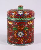 A 19TH / 20TH CENTURY CHINESE CLOISONNE CYLINDRICAL BOX AND COVER, decorated upon a red ground