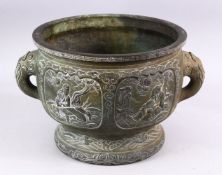 A 19TH CENTURY CHINESE BRONZE IMMORTAL TWIN HANDLED CENSER, with carved panel decoration depicting