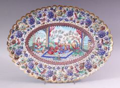 AN INDIAN ENAMELLED COPPER DISH of lobed oval form, the centre painted with a courting couple and