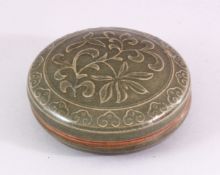 A GOOD CHINESE LONQUAN CELADON MOULDED PORCELAIN BOX & COVER, with moulded lotus decoration, 11cm