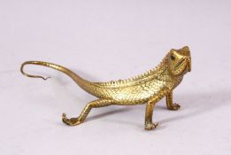 A SMALL POLISHED BRASS LIZARD, 17cm long.