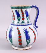 AN IZNIK STYLE POTTERY JUG, with classic Iznik style floral decoration, Cantagalli mark to base,