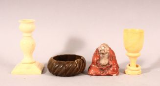 A MIXED LOT containing a horn bracelet, turned ivory candlestick, a turned ivory goblet and a