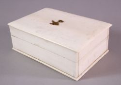 A 19TH CENTURY INDIAN IVORY LIDDED BOX - with an on laid gilt metal elephant, 15.5cm x 11cm