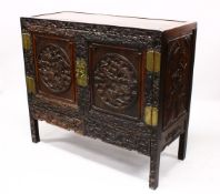A LOVELY 19TH CENTURY CHINESE HARDWOOD / HONGMU CARVED DRAGON TWO-DOOR CABINET, the door panels