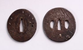 TWO 19TH CENTURY JAPANESE CAST IRON TSUBA, each with engraved and inlaid decoration, 7cm and 7.5cm.