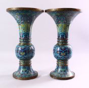 A GOOD PAIR OF 19TH CENTURY CHINESE CLOISONNE GU FORM VASES, on pale blue ground with stylised