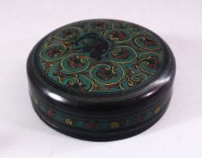 AN INDIAN PAPIER MACHE CIRCULAR BOX AND COVER, 12cm diameter.