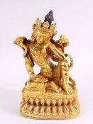 A TIBETAN GILT BRONZE FIGURE OF A SEATED FEMALE DIETY, 20cm high.