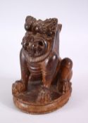 A 17TH CENTURY OR EARLIER SOUTH INDIAN CARVED WOODEN YALI FIGURE, 17cm high x 13cm wide.