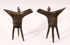 A SMALL PAIR OF CHINESE ARCHAIC FORM CAST BRONZE TRIPOD CENSERS, 13cm.