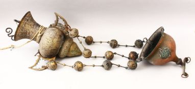 A 19TH CENTURY ISLAMIC BRASS / STEEL OPENWORK CALLIGRAPHIC HANGING LAMP.