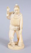 A JAPANESE MEIJI PERIOD CARVED IVORY OKIMONO OF A FISHERMAN, the man stood holding his net, with one
