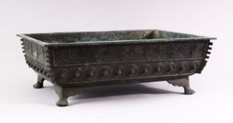 A CAST BRONZE RECTANGULAR BONSAI PLANTER, cast a key border and shield shaped motifs on curving