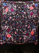A 20TH CENTURY CHINESE EMBROIDERED BLACK SILK PIANO SHAWL / TEXTILE, with floral embroidery and