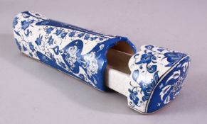A 19TH CENTURY TURKISH IZNIK BLUE AND WHITE DECORATED PEN BOX, 28cm long.