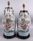 A GOOD PAIR OF 19TH CENTURY CANTON CHINESE FAMILLE ROSE PORCELAIN VASES, the body with a pink ground