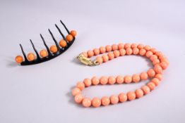 A SEA BAMBOO / CORAL NECKLACE, and similar hair slide.