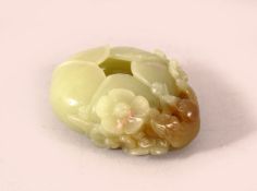 A SMALL CELADON JADE BUD FORM BRUSHWASHER, the side decorated in high relief with a tengu and
