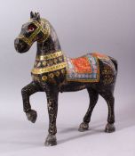 A KASHMIRI PAINTED CARVED WOOD MODEL OF A PRANCING HORSE, 38cm long