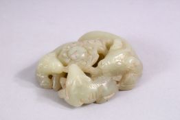 A SMALL CHINESE CARVED JADE GROUP of three rams, in a fitted box.
