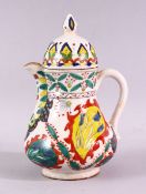 A 19TH CENTURY TURKISH KUTAHYA WATER JUG AND COVER, overall height 20cm.