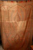 A LARGE PAISLEY BED COVER OR THROW, of typical form, 320cm x 155cm.