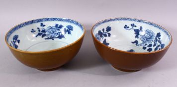 A PAIR OF CHINESE NANKING CARGO SHIPWRECK BOWLS, the interior with blue and white floral decoration,