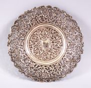 A 19TH CENTURY INDIAN SILVER OPEN WORKED DISH, with formal floral decoration and openwork, 18cm.