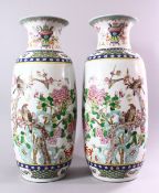 A LARGE PAIR OF 20TH CENTURY CHINESE FAMILLE VERTE / ROSE PORCELAIN VASES, decorated with scenes